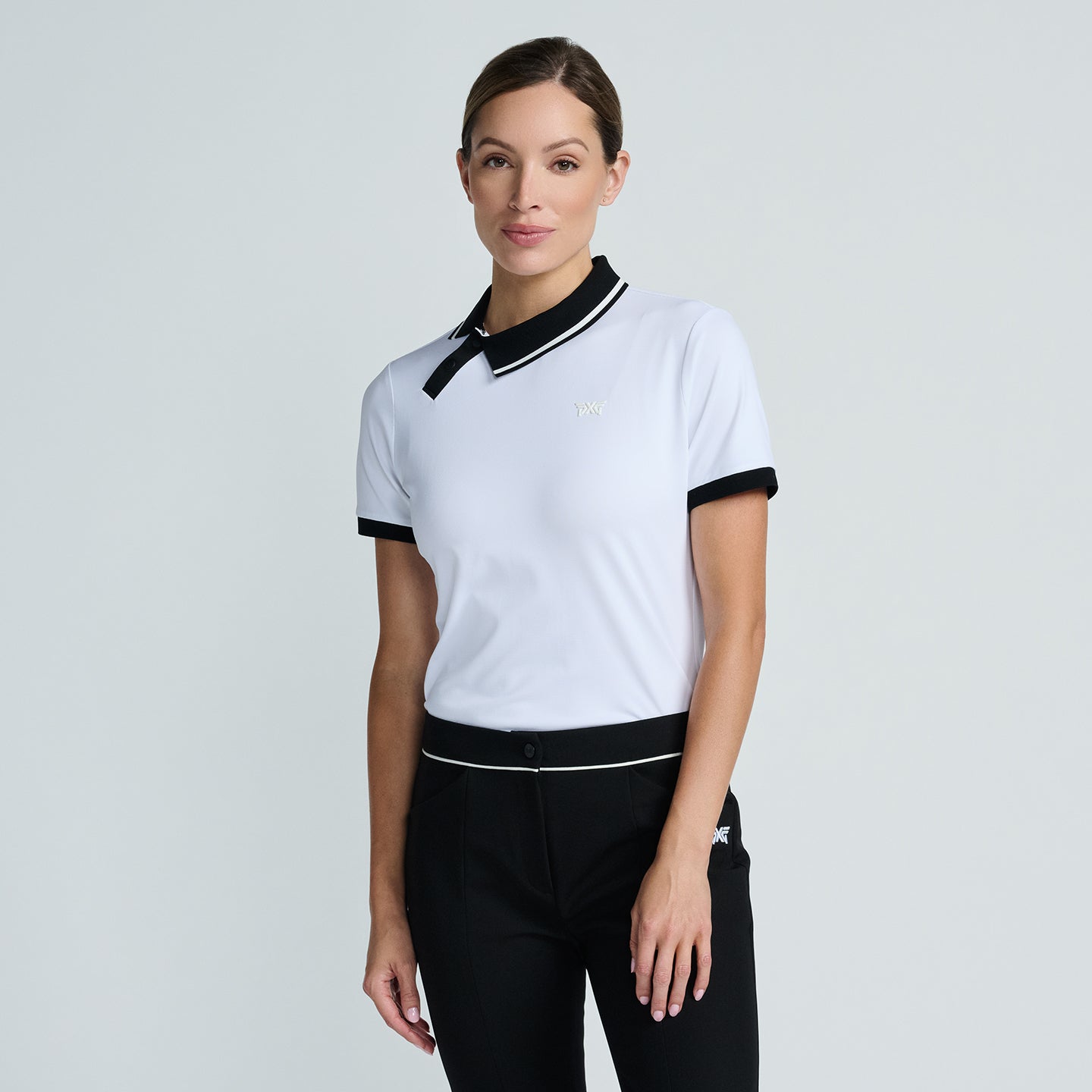 CW-WE25ATP1-78WH-Womens-Asymmetric-Collar-Polo-White-Front Women's Asymmetrical Snap Collar Polo - Image 1